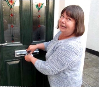 Sue Atkins on doorstep, photo by TUSC Sue Atkins on doorstep, photo by TUSC